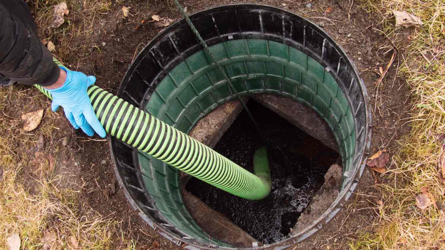 hose pumping out septic tank