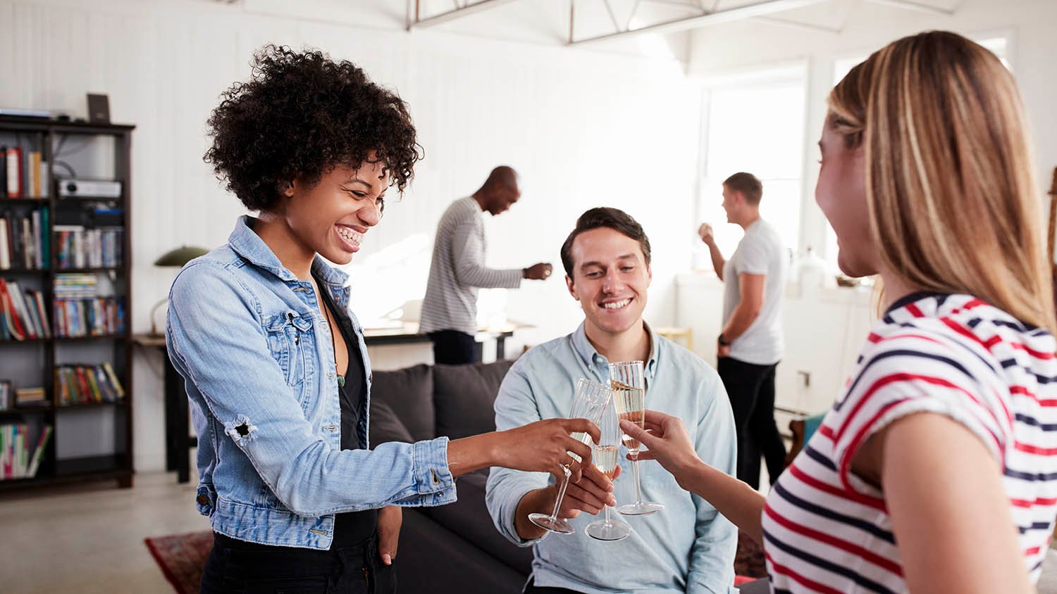 group of friends toasting at a party