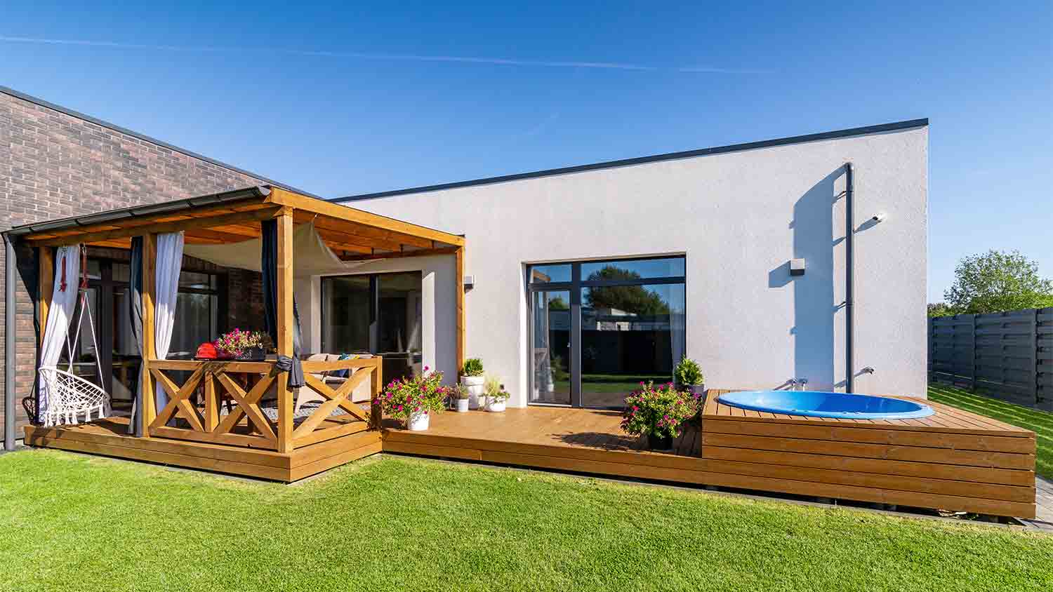 house with hot tub deck
