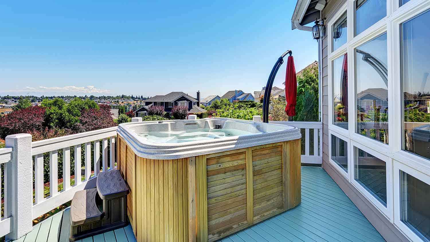 Wooden hot tub on a patio deck