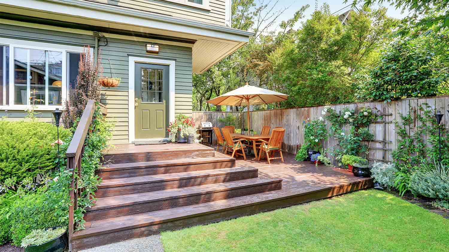 green home with entryway deck