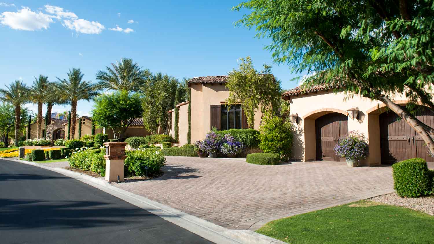 A house with a pavers driveway