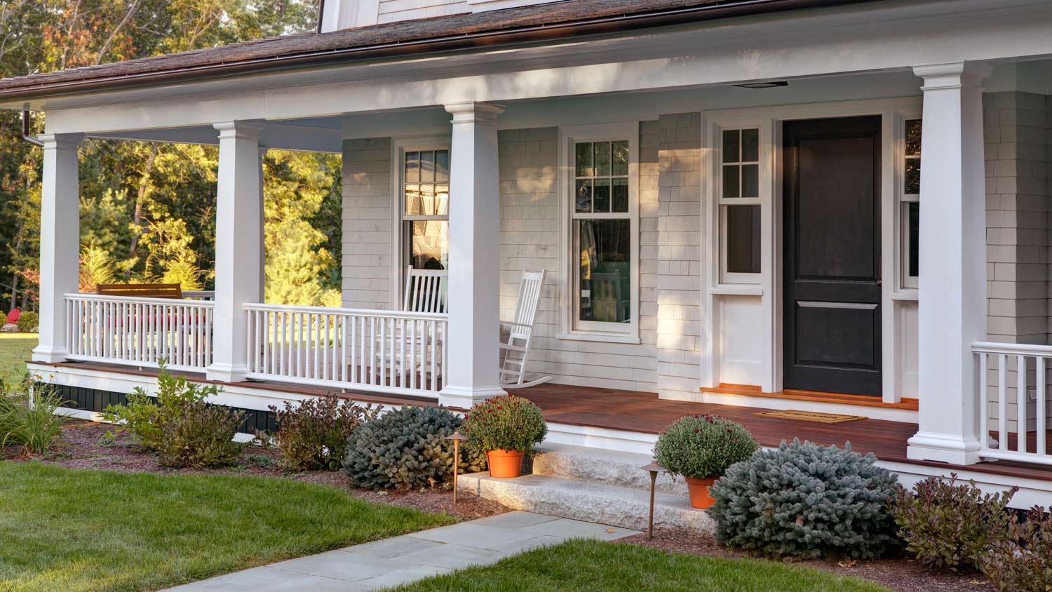 The exterior of a house with a porch