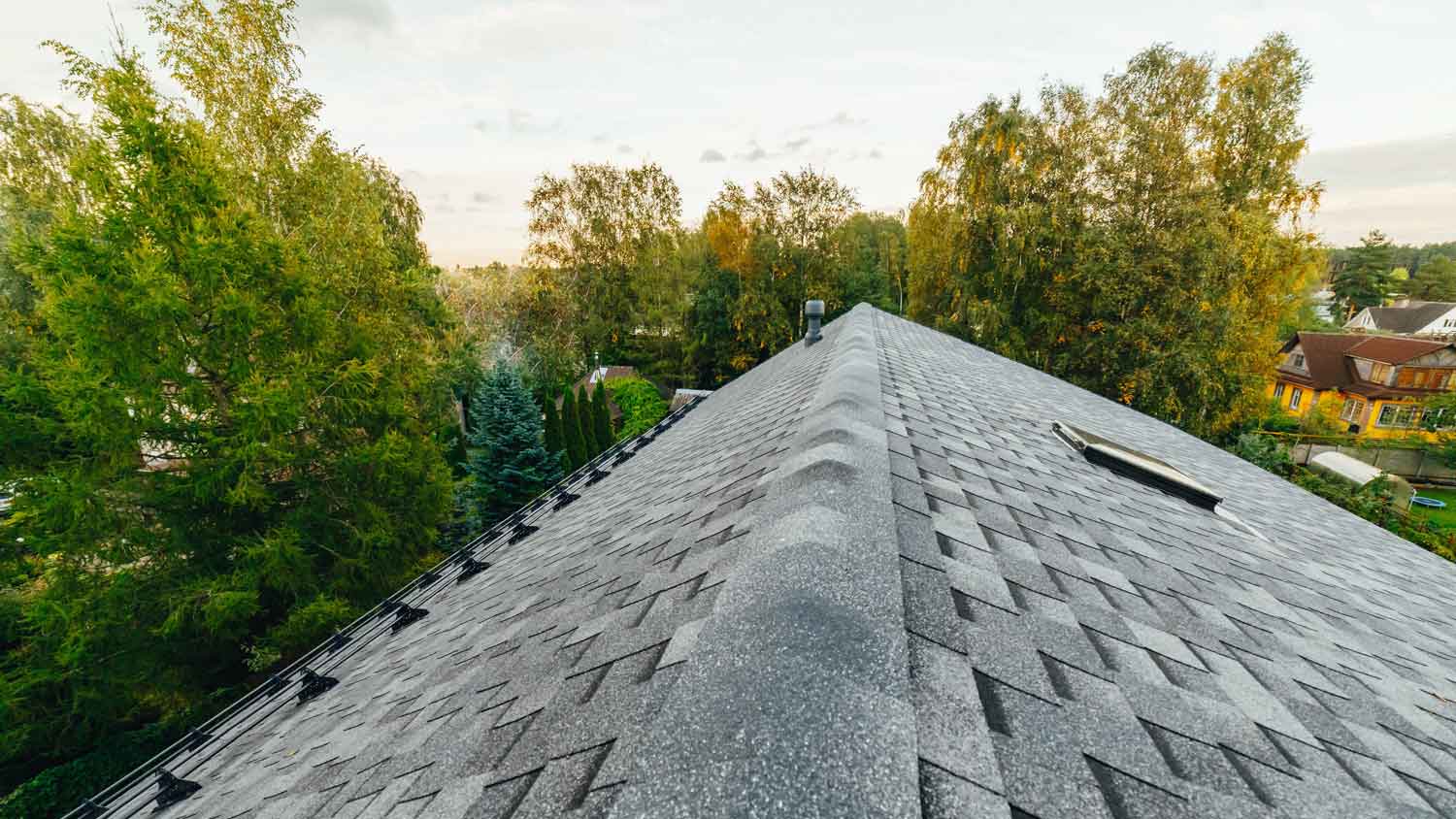 A house roof with asphalt shingles