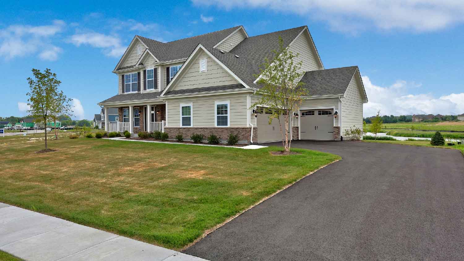 A house in the suburbs with an asphalt driveway
