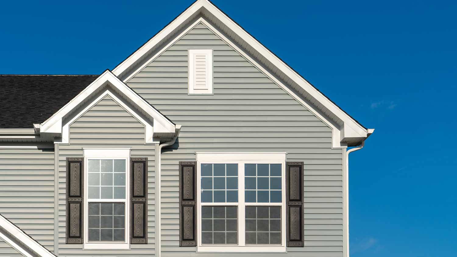 grey house with vinyl windows