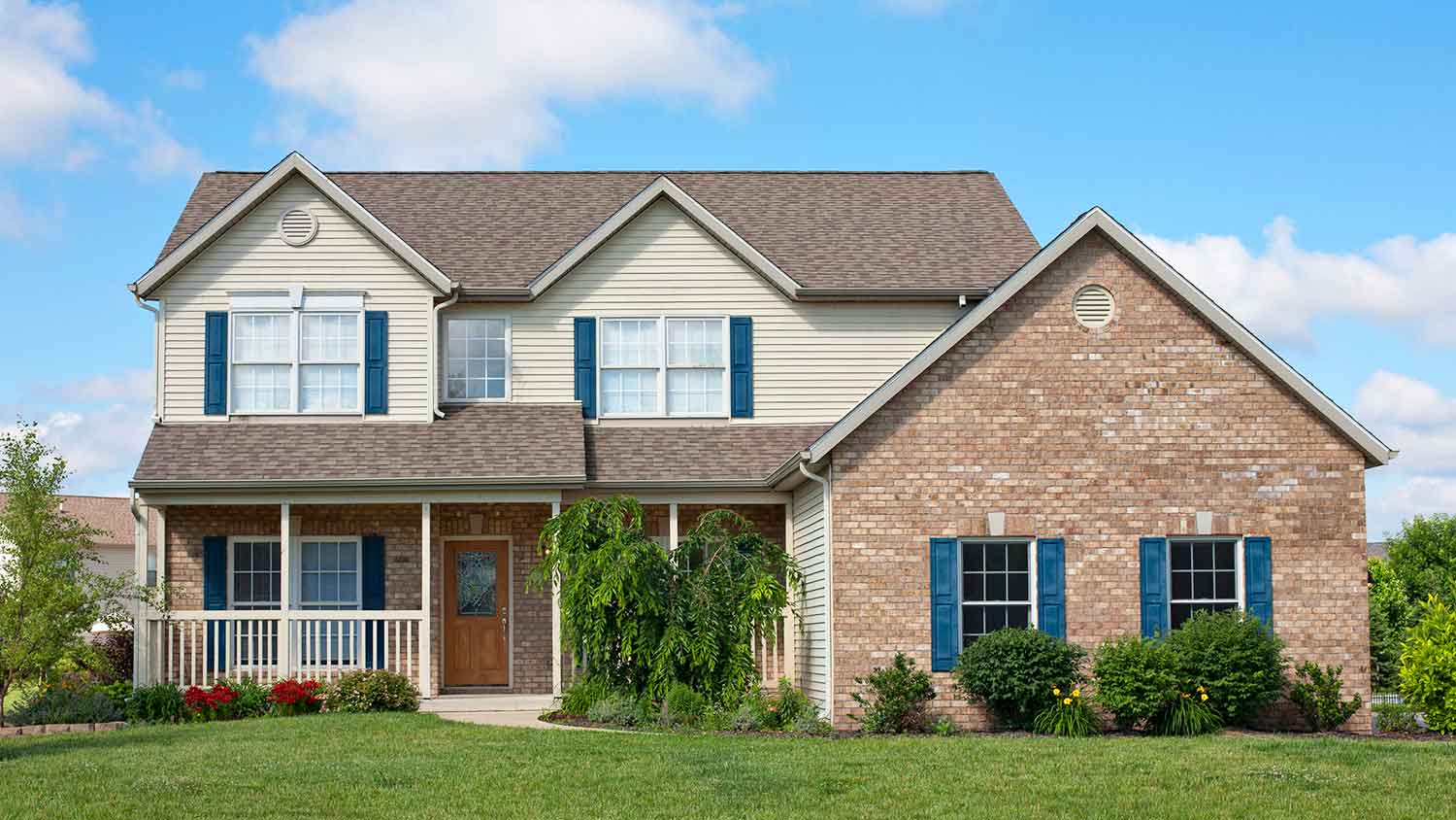 Large house with blue window shutters