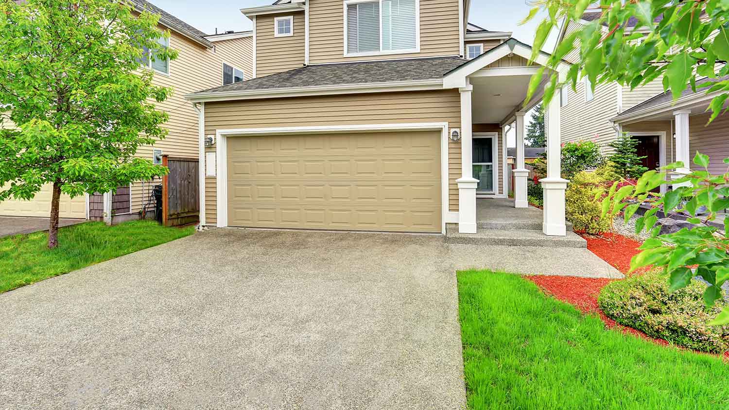 Chip seal driveway installed at a suburban house 