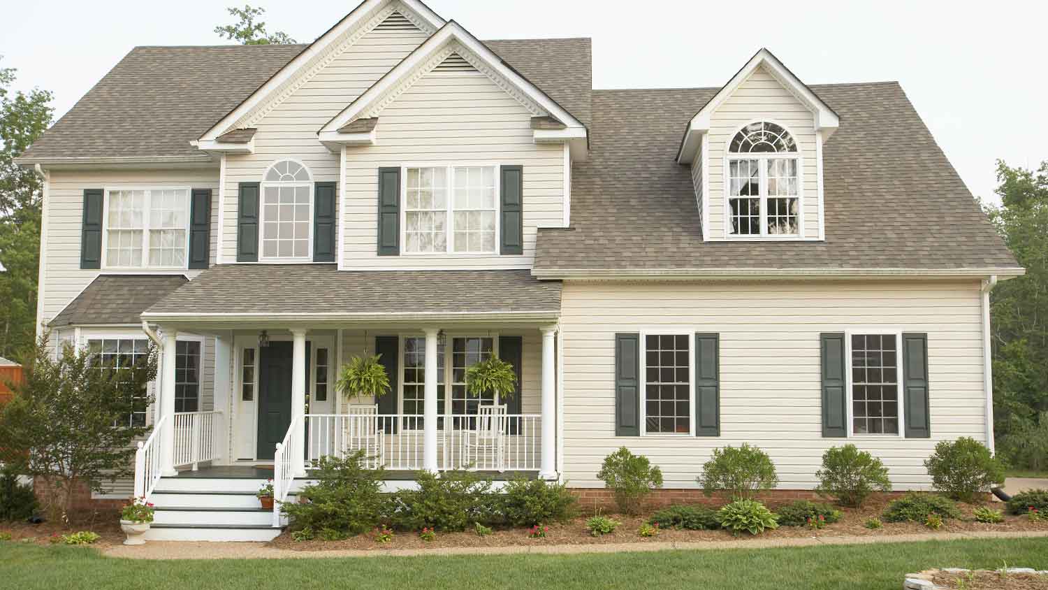 Two story white house with front porch