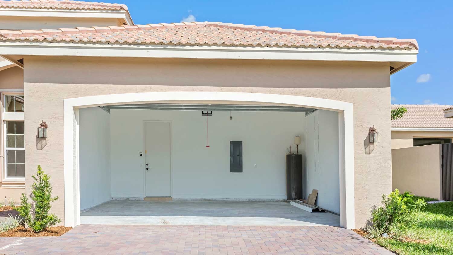 Suburban house with the garage door open