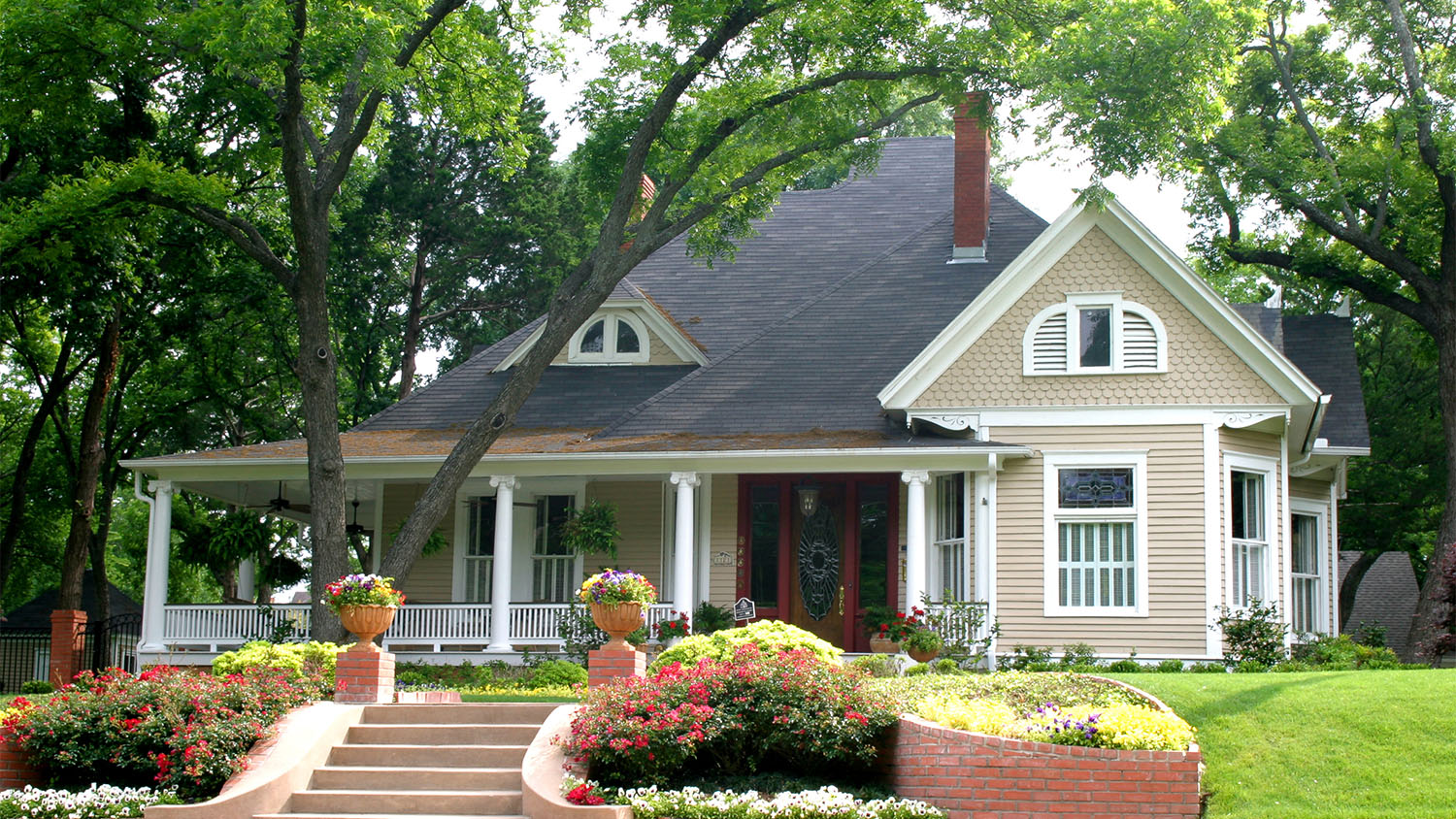 A large house with trees in its front yard