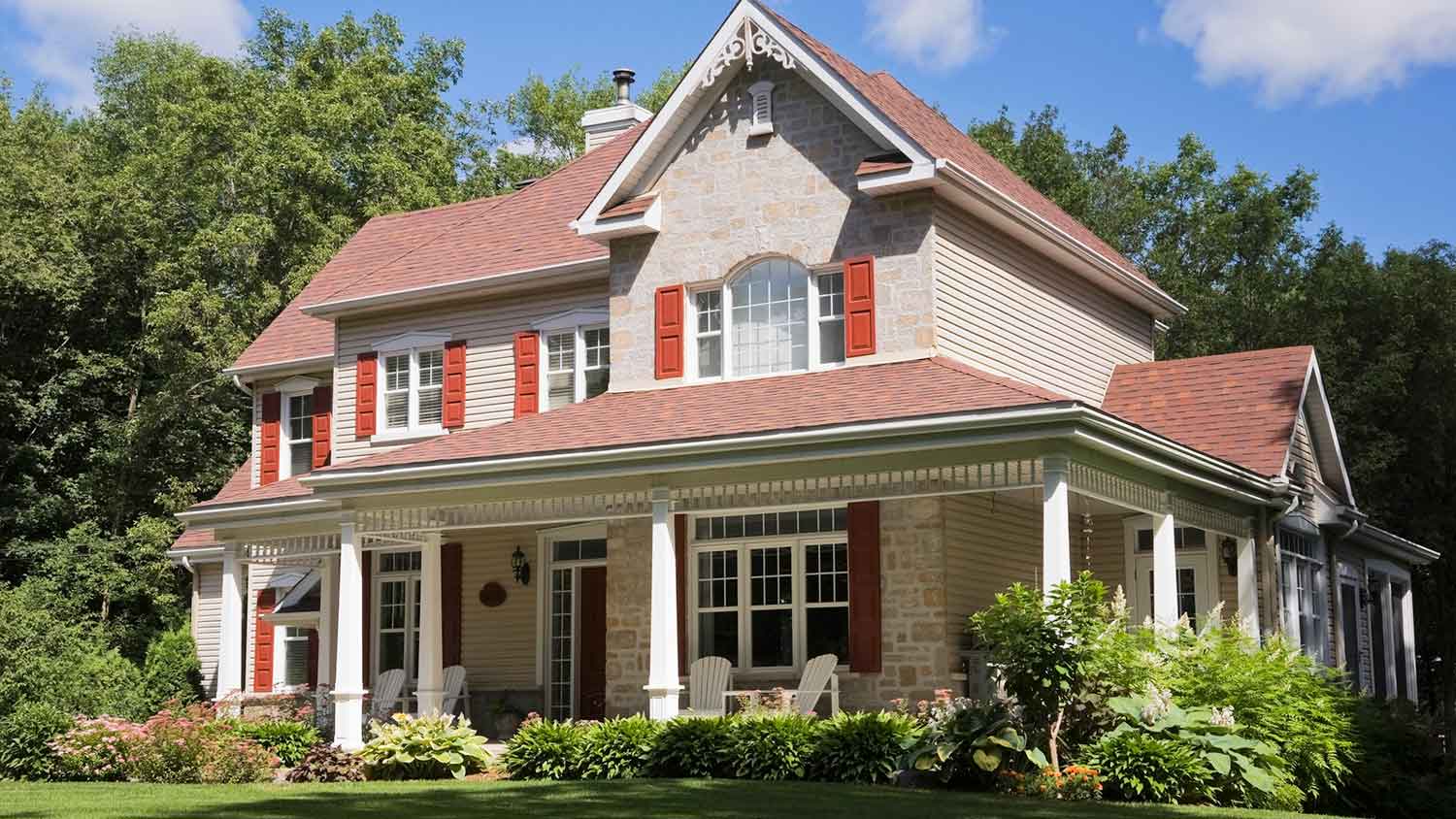 House with red roof and red window shutters