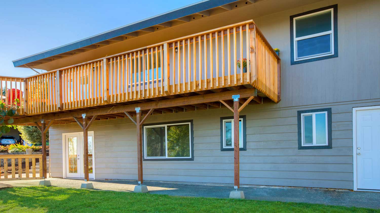 House with a walkout deck on the second floor