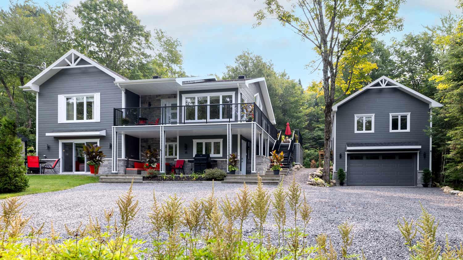 Luxurious gray and white property and detached garage