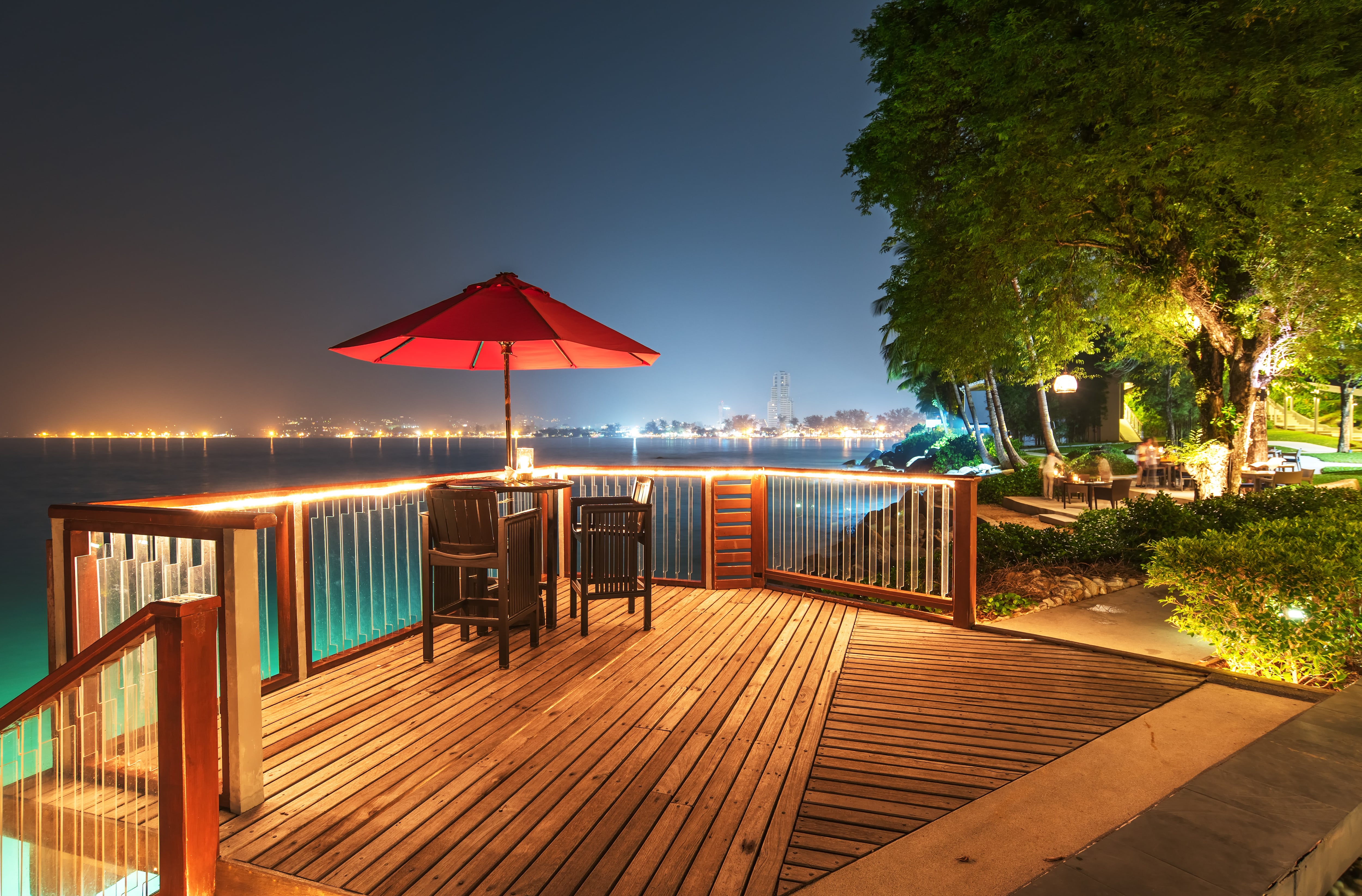LED string lights strung along deck railing