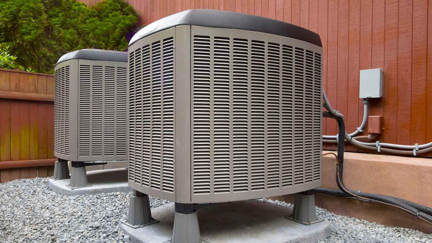 Dual fuel air conditioner units sitting in the yard