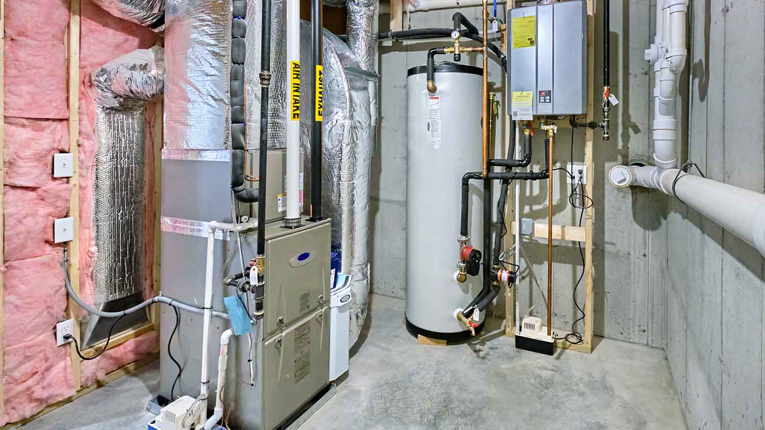 Basement with indoor HVAC unit and water heater