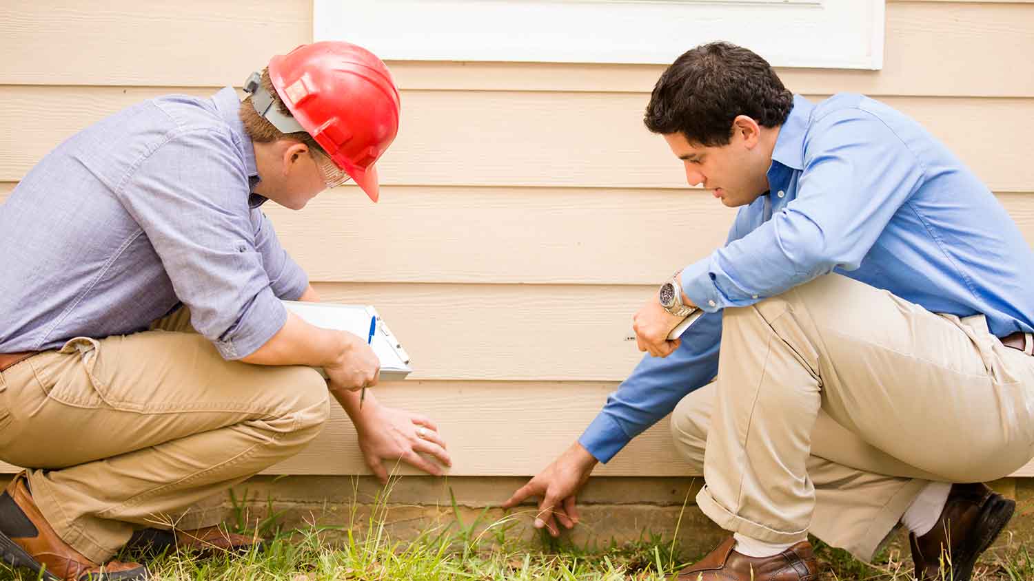 Inspector and homeowner detecting a slab leak