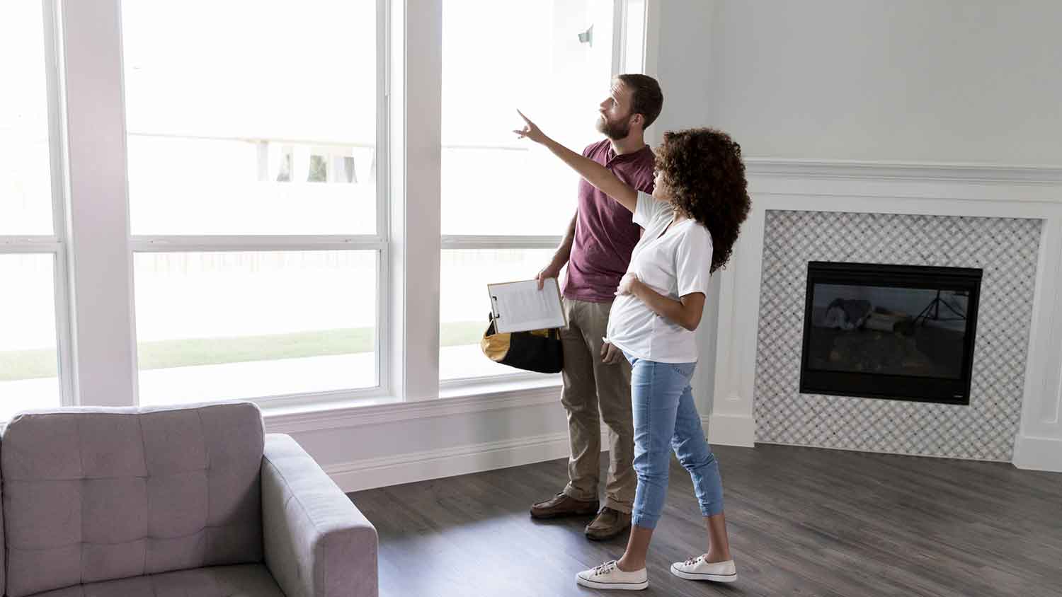Inspector and client checking the windows of a new condo