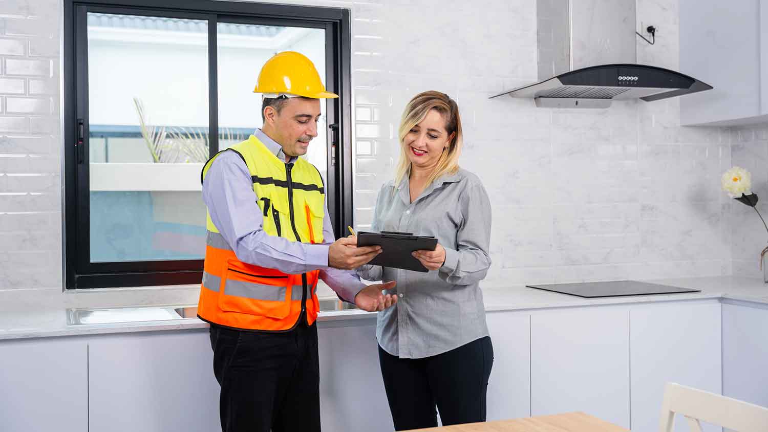 Inspector discussing the condition of the home with a client