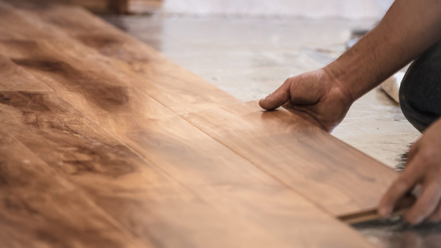 man installing new hardwood floor