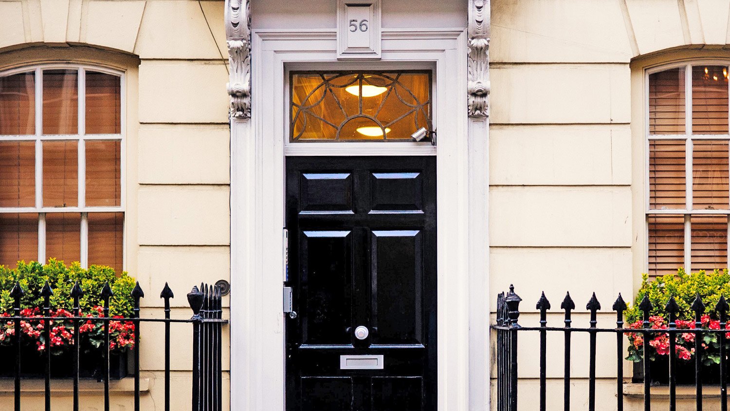 black front door in front of the home