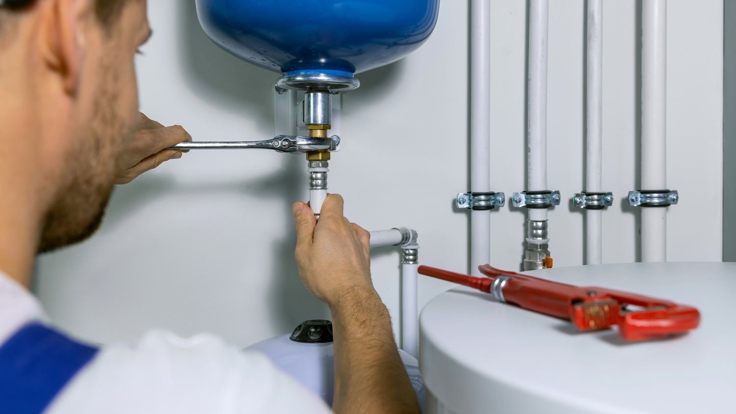 plumber installing water heater expansion 
