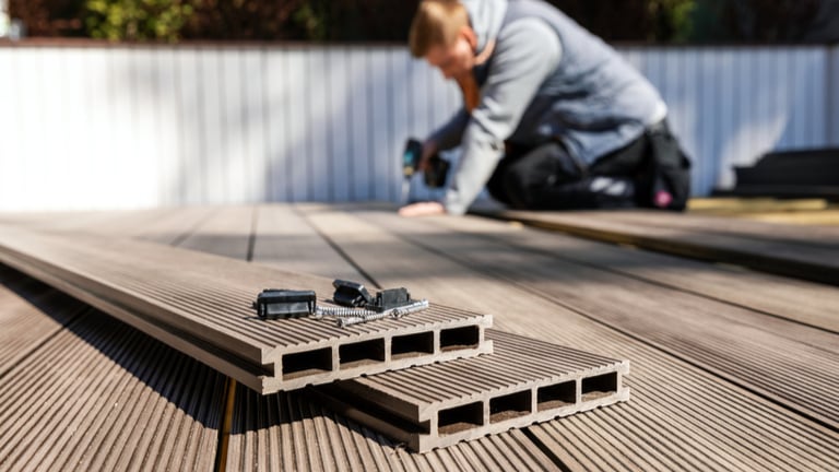 Deck contractor installing composite wood