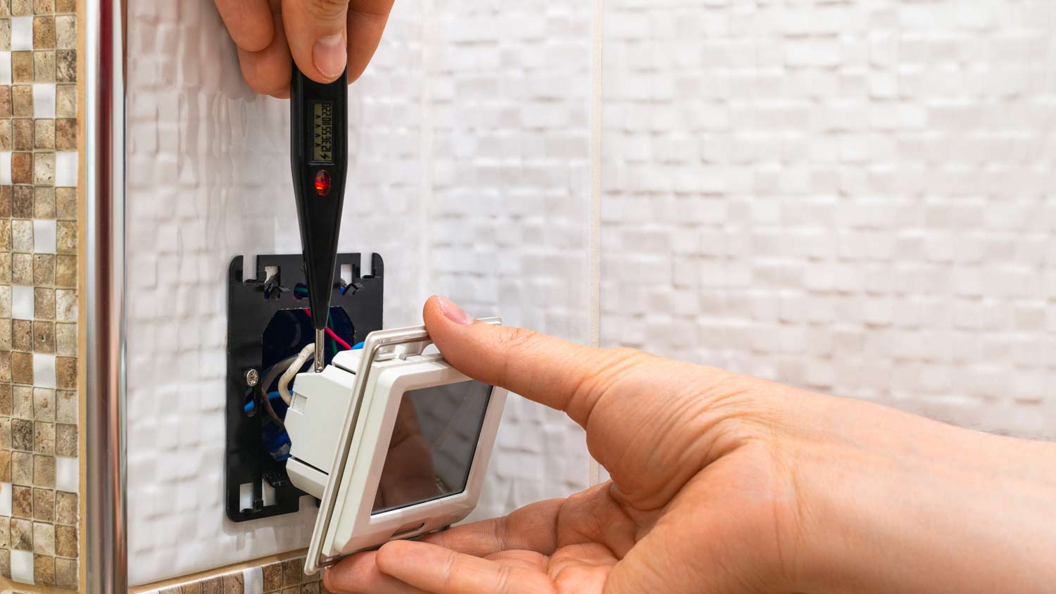 man installing smart switch