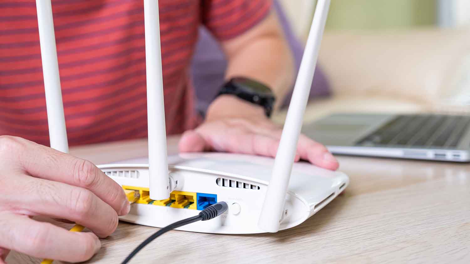 Connecting a cable to an internet router  