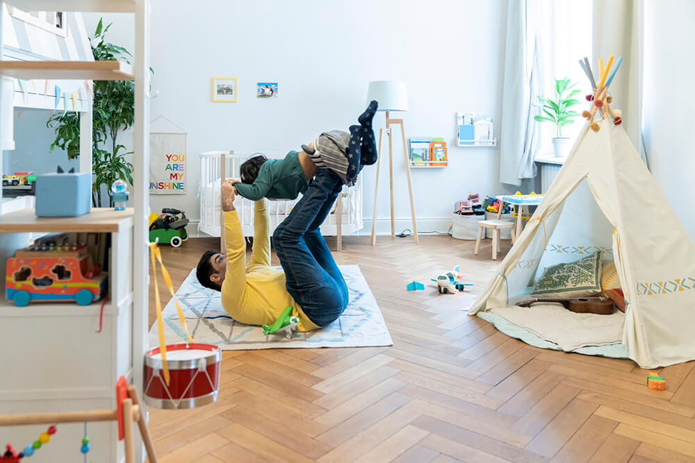 Child's bedroom with herringbone pattern wood flooring