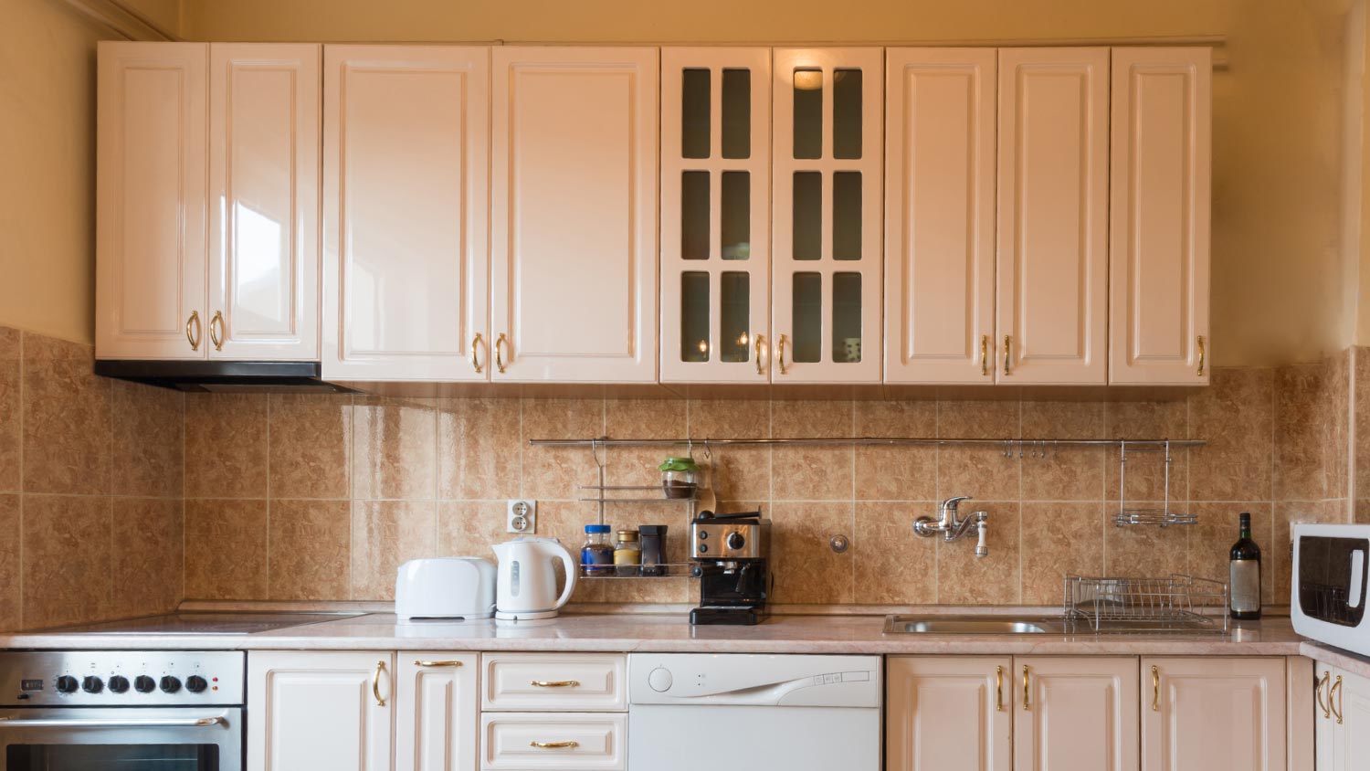 A kitchen with oak cabinets