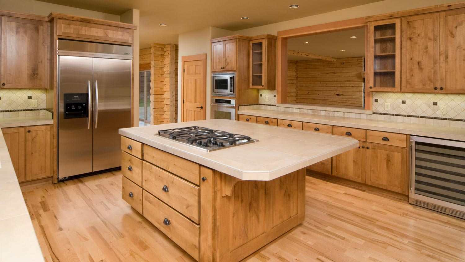 A kitchen with pine cabinets