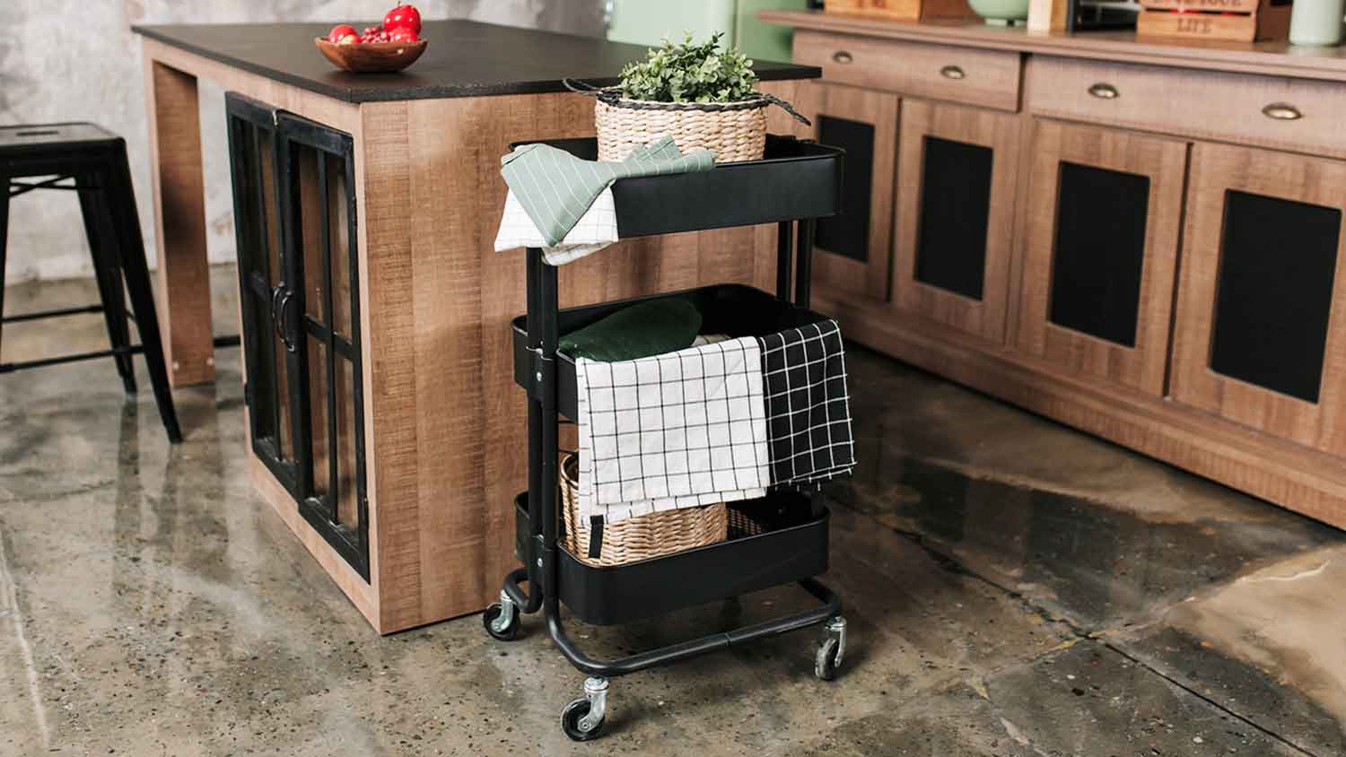 Kitchen rolling cart with towels and herbs