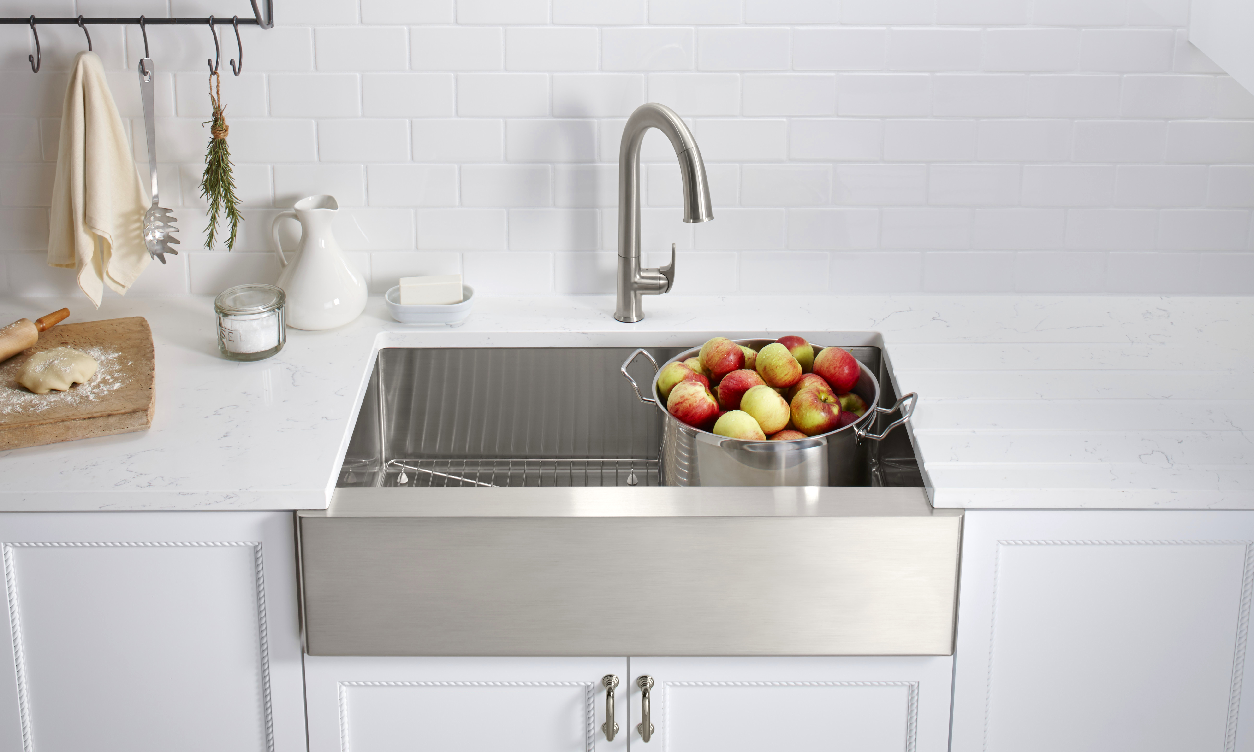 pot of apples in kitchen sink