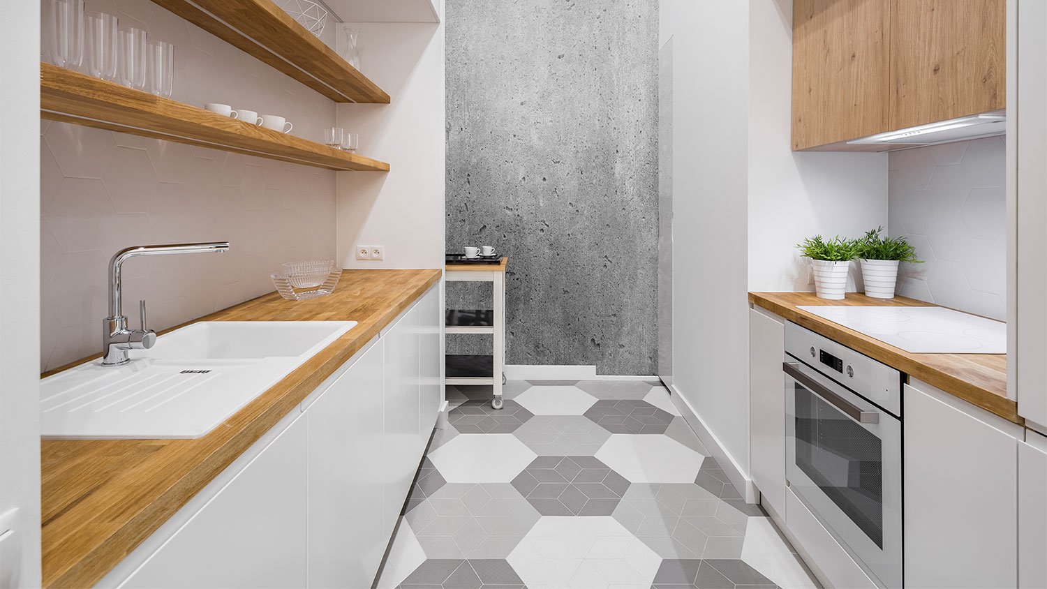 A view of a kitchen with tile flooring