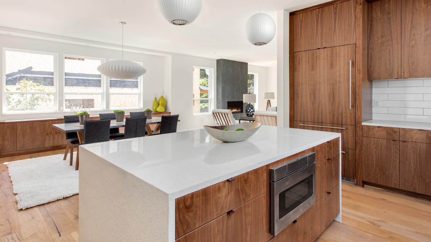 A kitchen with walnut cabinets