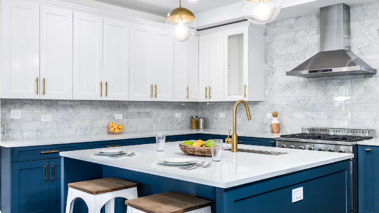 A kitchen with white quartz countertops
