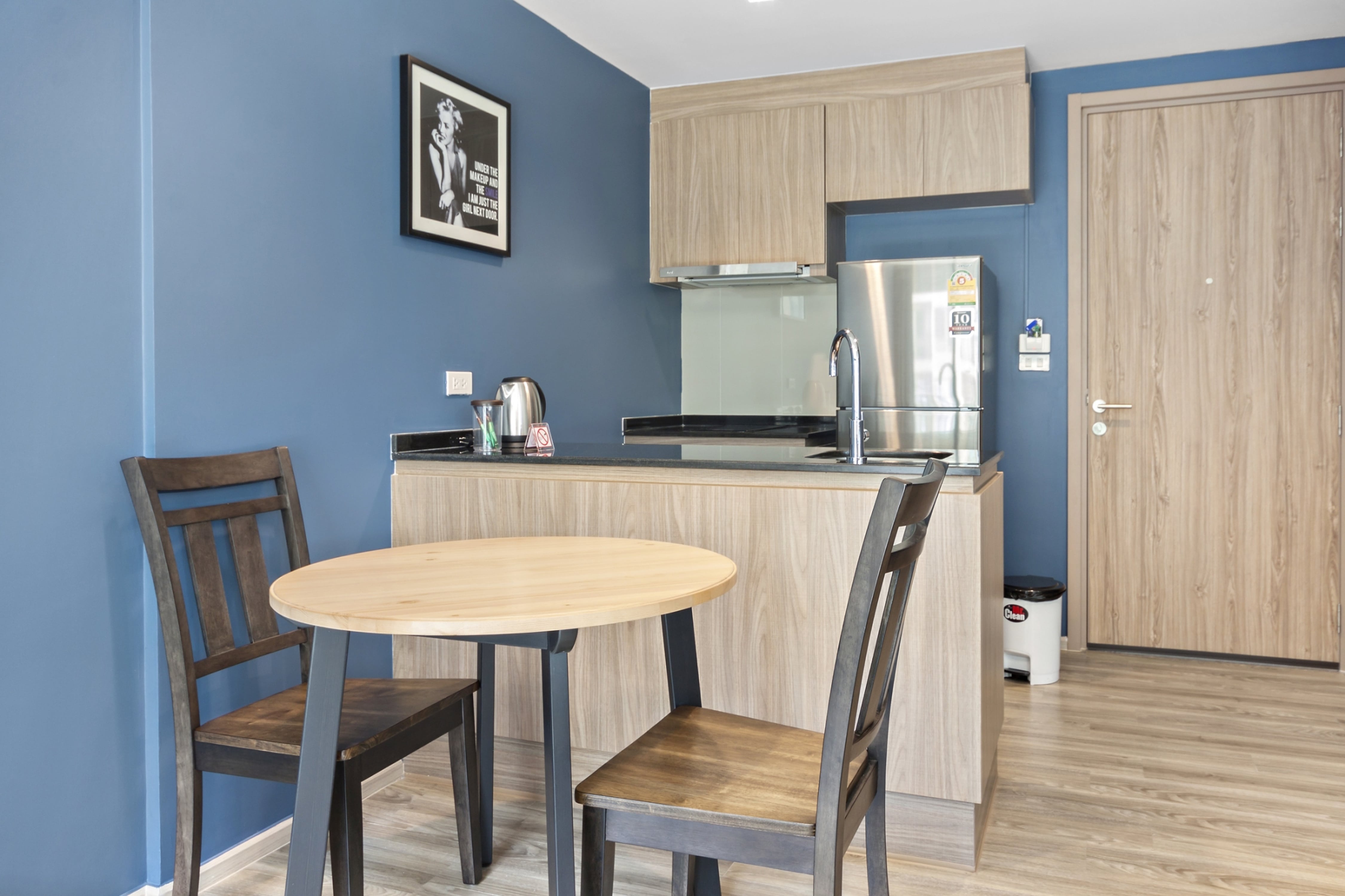 Light wood cabinets in modern kitchenette