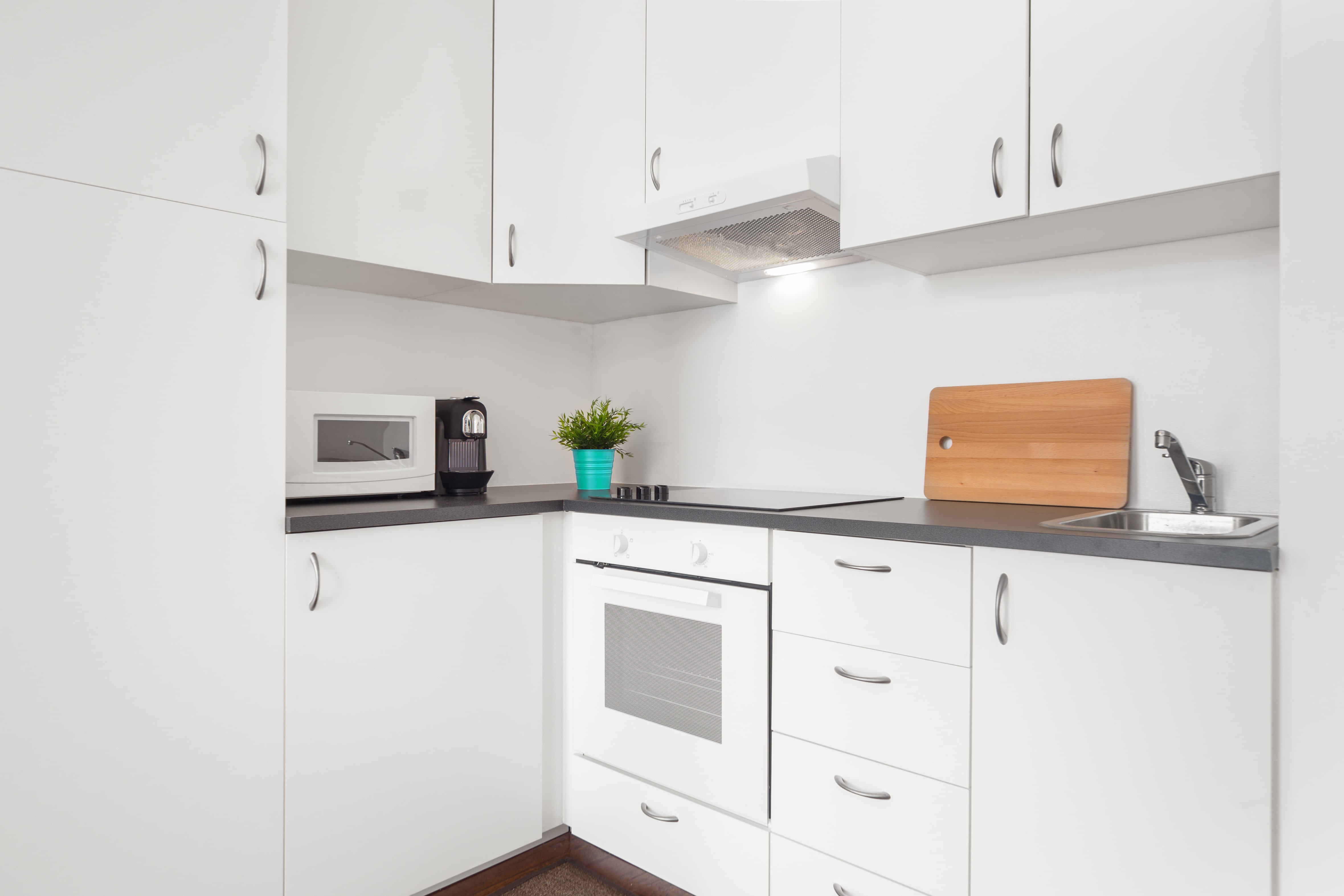 Small kitchen area with white-on-white color scheme