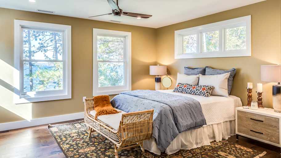 Double hung windows installed in a lake house bedroom 