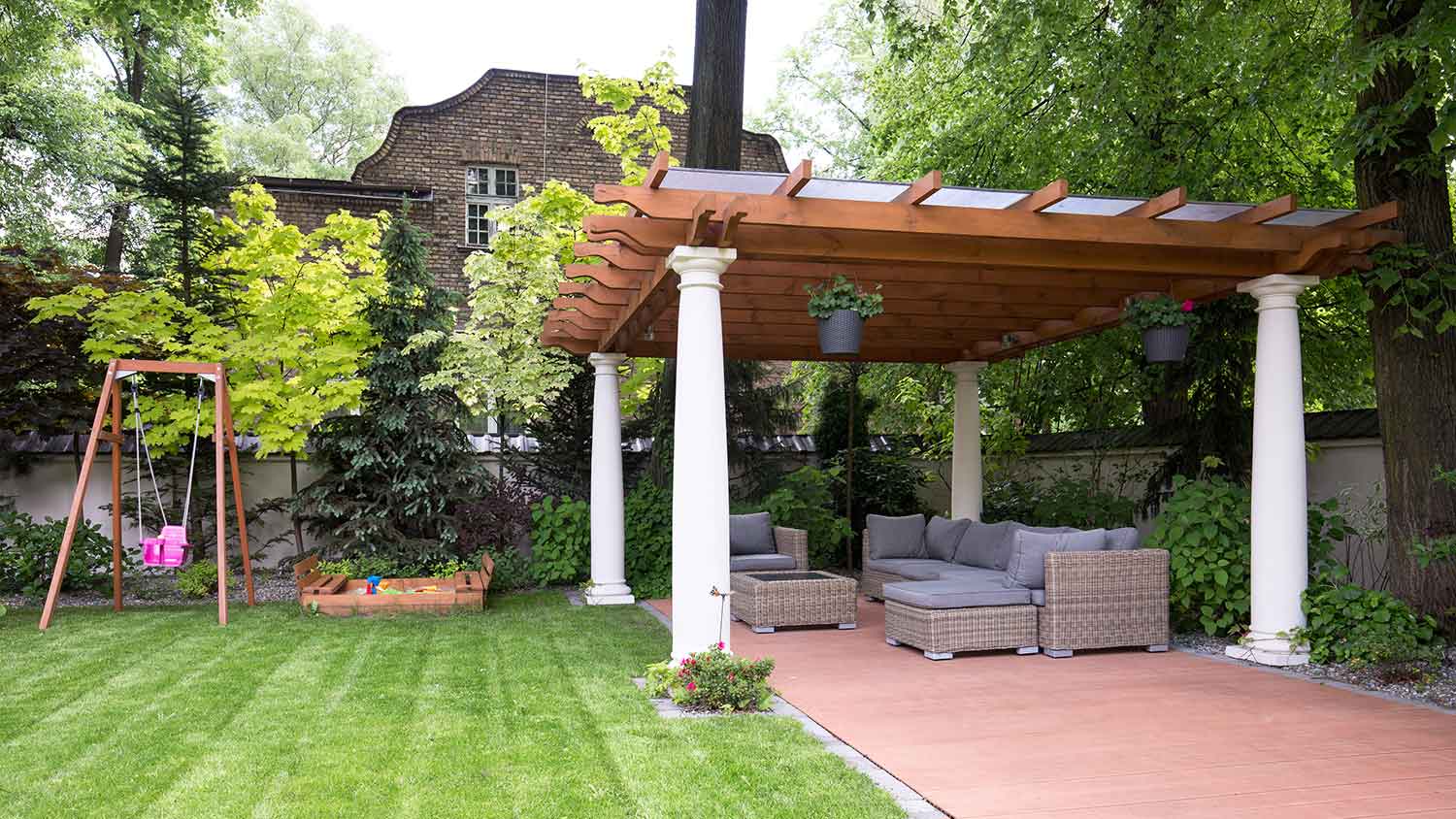 Yard with freestanding pergola and outdoor furniture