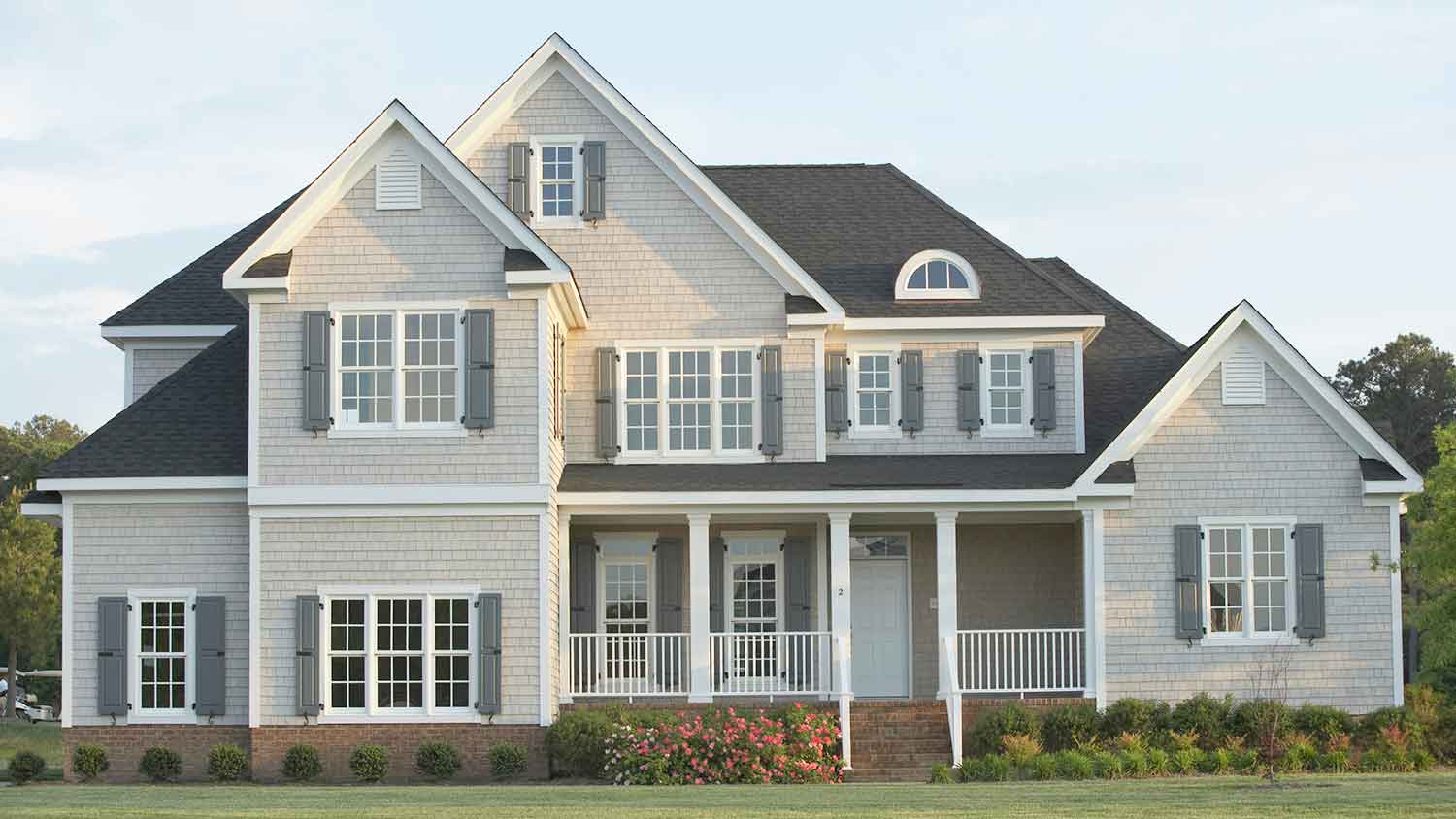 Large gray house with porch