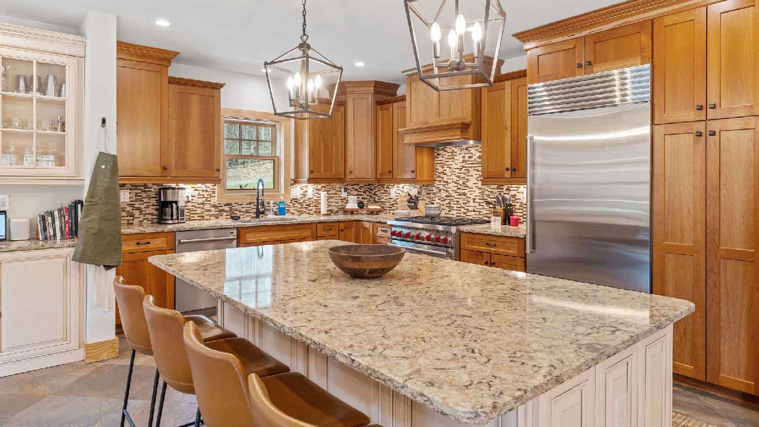 A large kitchen with granite countertops
