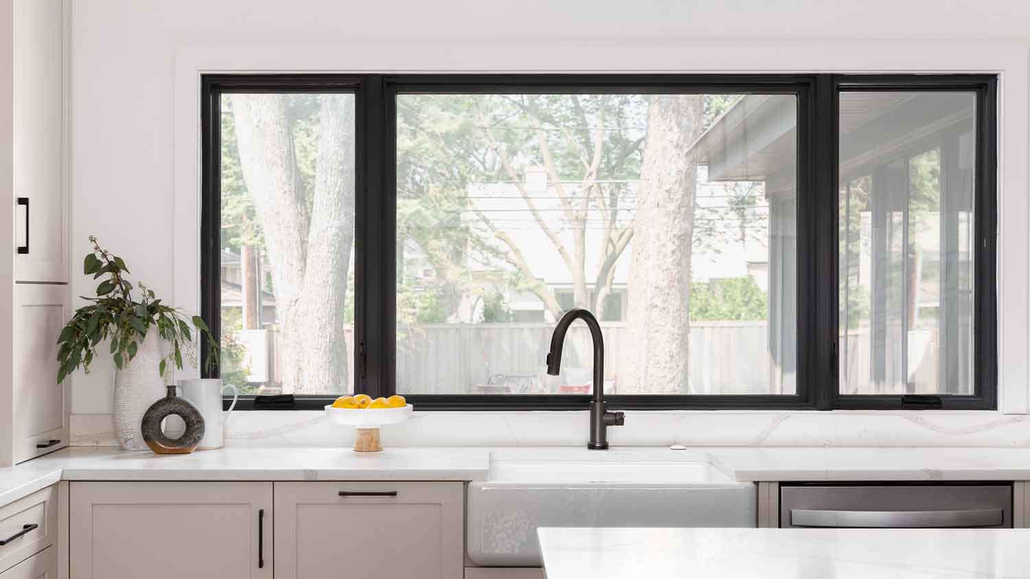  Large sliding window installed in a modern kitchen 
