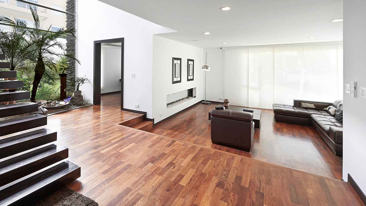 Large modern living room with hardwood flooring