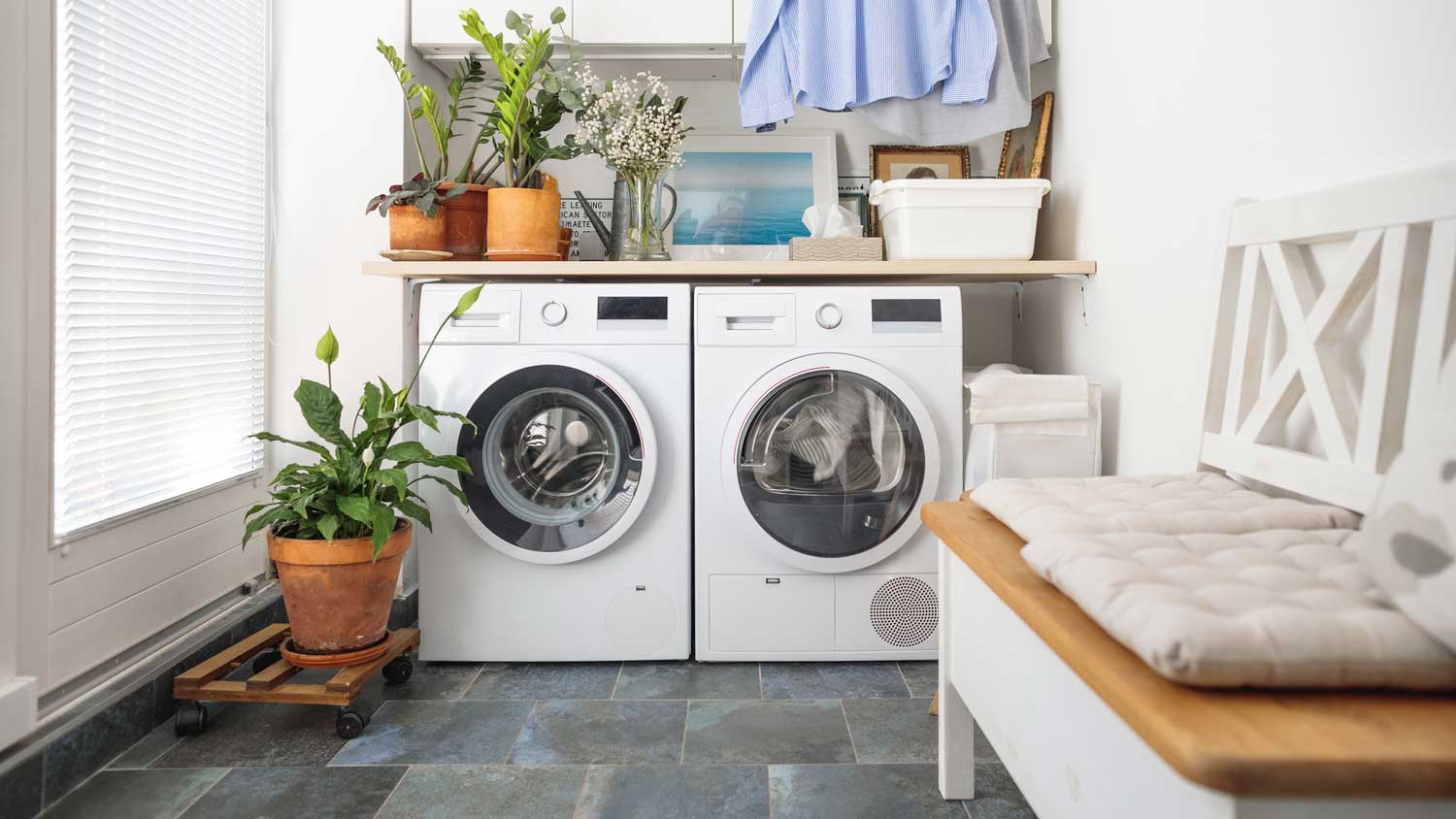 A laundry room with a front load washer and a dryer