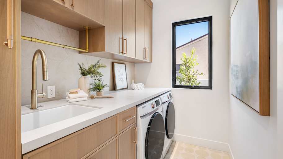 A laundry room with a utility sink