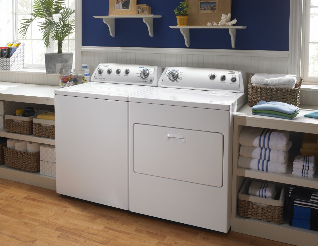 washer and dryer with shelves beside and above