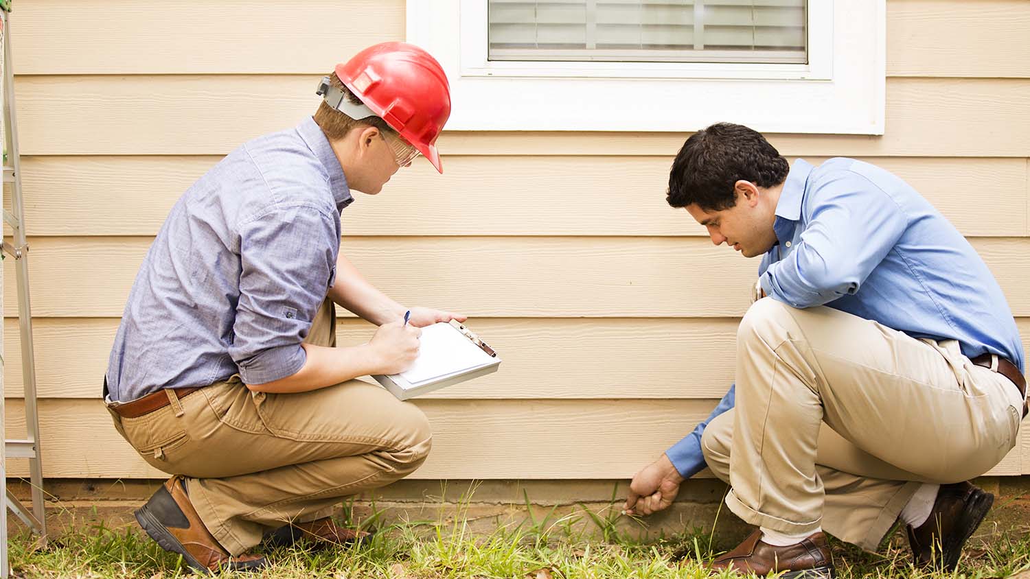 inspectors looking at home foundation